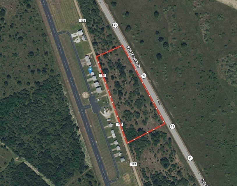A really rare opportunity to own a large piece of Hwy 71 frontage. Not only does it front Hwy 71 but also County Road 102 and is directly next door to the airport. Ag exemption in place. Great tree coverage. Wonderful opportunity!