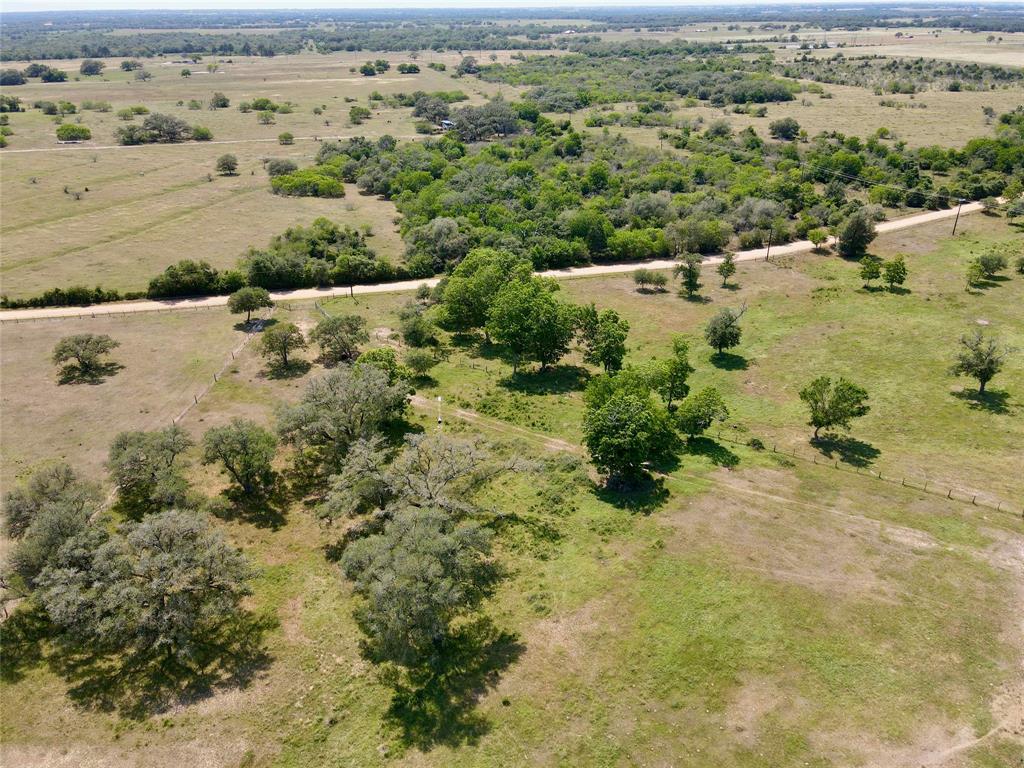 Lavaca County, very nice rectangular shaped 19.62 acres in the Sweet Home area with Yellow Bank Creek running in the far southern boundary.  The creek lined with mature trees will make a great backdrop for a backyard view from your weekend home or permanent resident.  Water well, electrical and entrance is in place. Property is located less than 1/2 mile off of Paved CR 381.

Set up a feeder and game camera and watch what country living can share with you. The property is  fenced excluding the east boundary between tract 1 and 2. The fence is in good condition and is constructed of netting wire and pipe along CR 380 and the south fence is almost  new. Property holds an agriculture exemption and is presently being used for cattle. There is some cross fencing and pens for cattle and an old metal building. There is a nice slope toward the southern end of the property.