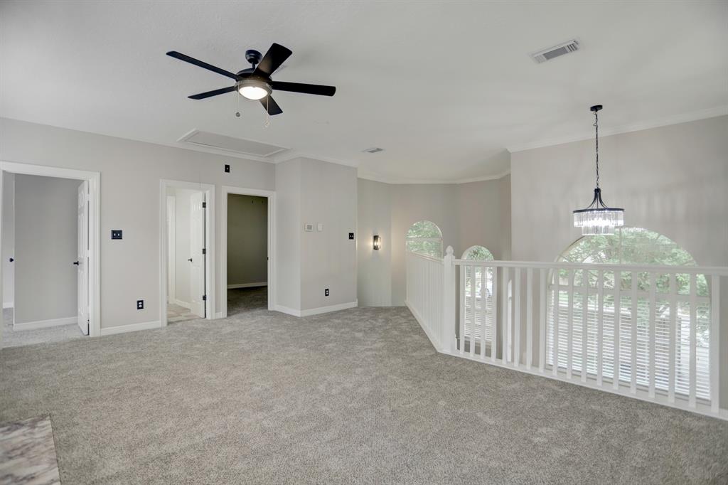 The new carpet, paint, fixtures, hardware and ceiling fan really make this GAMEROOM area stand out!