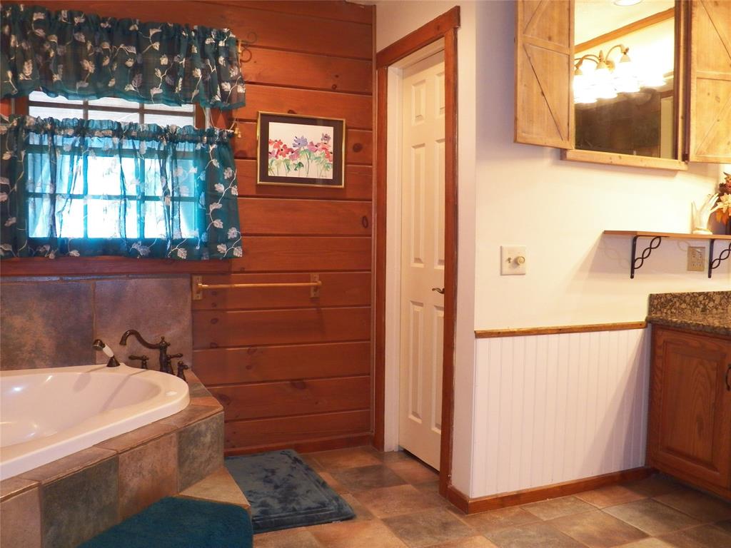 Primary On-Suite Bath is very functional and offers a relaxing jetted corner tub (perfect after a long day) and a large walk-in shower with multiple shower heads.