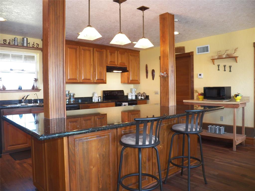 The Guest House has a very large Kitchen with its own huge Island that offers plenty of space to add up to 5 bar stools.  Whether serving Breakfast or a Full Buffet - this Island is perfect!