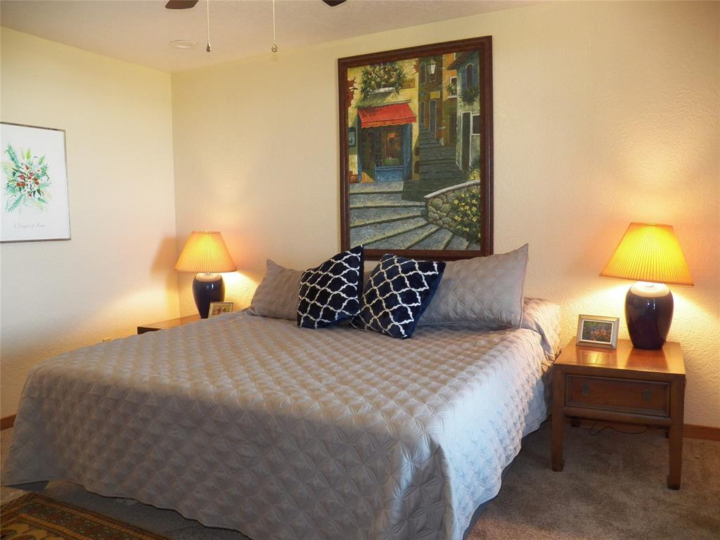The Guest House has 2 Primary Bedrooms (1 down & 1 up).  This Downstairs Bedroom is spacious and overlooks the Bay.
