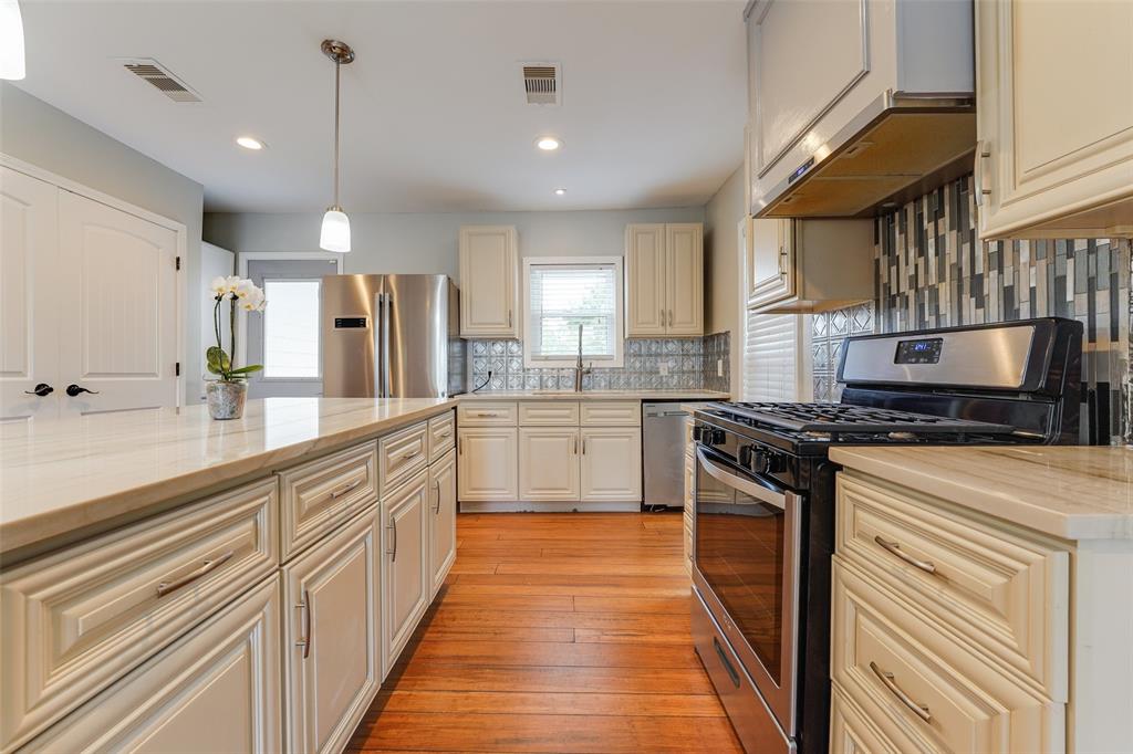 Spacious kitchen with a brand new stove for all your culinary needs.
