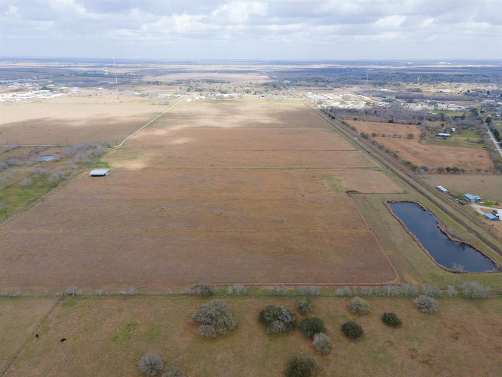 115.71 acres with the front approximately 1250 feet of frontage on Hwy 60 within the ETJ of Bay City. 20 miles from the Matagorda Bay and 60 miles from Sugar Land it's a sportsman's paradise close enough to fishing and hunting and just far enough from the city. Clay shooting, hunting, fishing, kayaking, birding. Property has a producing pecan orchard, cattle lease and exemptions for hay. There is a 1.34 acre pond with well and electric pumps and watering pivot with 182 gallon flow. 30' easement for access on north side of property from Hwy 60 or access from county road on back side of property. Electric poles run from Hwy 60 to County road along north side of property. Several custom homes have gone in nearby. Prime location for development.