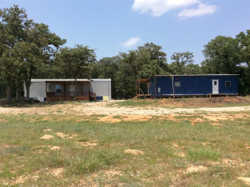 3655 County Road 430 Dime Box, Texas Want a country tract 10+ acres with mobile home and another building structure for housing/office/workshop? Mobile home is a one bedroom, one bath (416 sqft). The property is the right size for recreational, hunting camp, or country getaway and weekend events. Current buildings would work until your new home could be built. Property has oak, pecan trees, and other trees and brush plus grazing for livestock and wildlife. A pond is available . Public water and electricity is in place. Land is fenced with net wire for goats and other livestock, plus a small barn for animals. Storage shed is in place. Septic is needed. A pond site has been dug. Property is located one hour from several large towns, plus a few minutes to Dime Box or Giddings. Come see this relaxing tract away from the city!