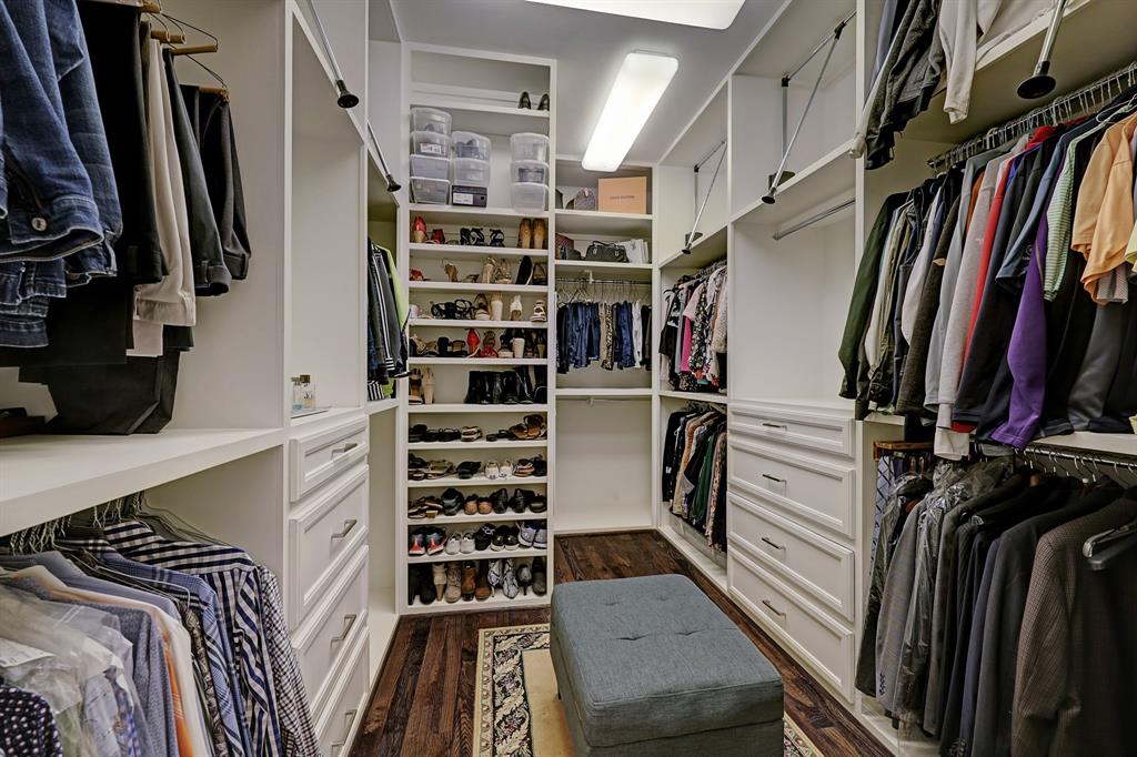 Look at this ample custom closet in the primary suite