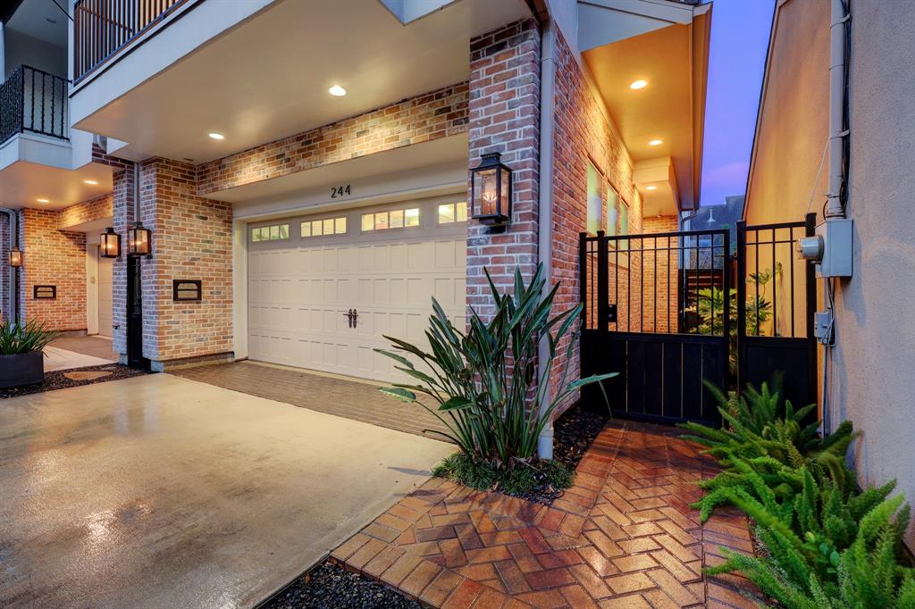 The private driveway and tasteful private gate add to the exterior's elegance.