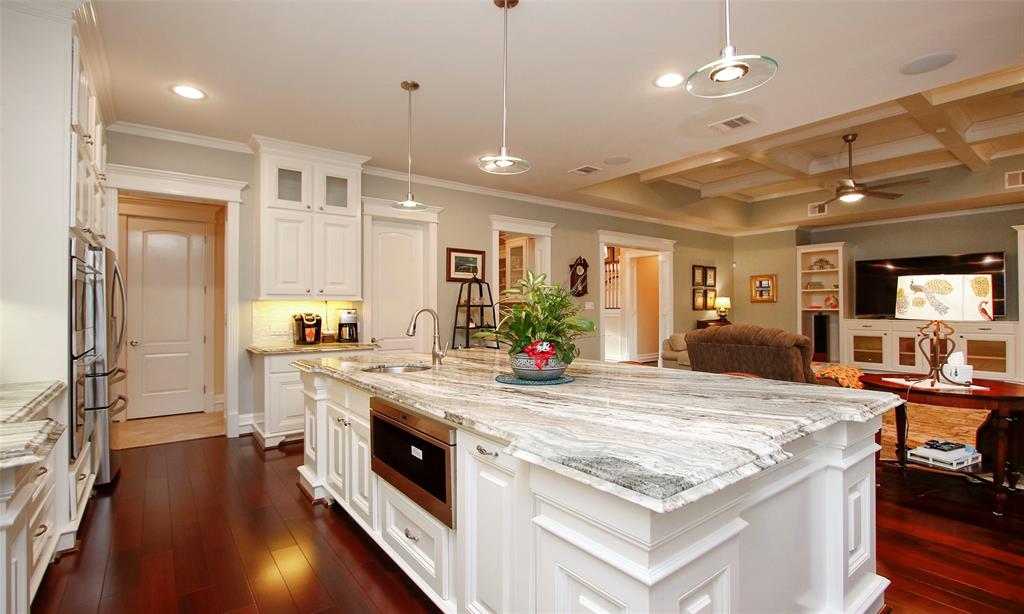 This kitchen offers a large island for storage, dining, food prep, and serving buffet style meals for your large gatherings.
