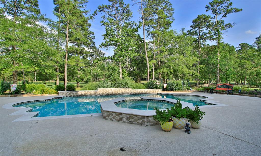 This large salt water heated pool and spa will be the hit for the hot Texas summers! Notice the large yard behind that overlooks the golf course!  You will love the surround sound that is in and out of this house!