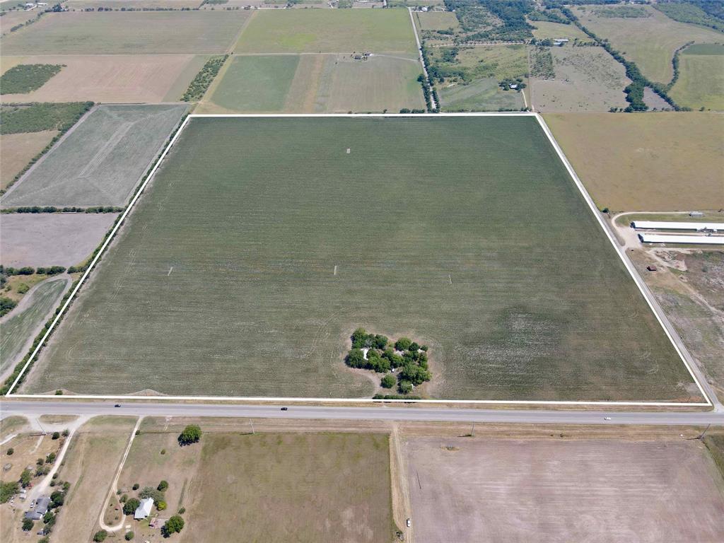 Commercial land development opportunity, just 4 miles from Interstate 10, at the intersection of US 90 and FM 2438. Great location just 5 miles from Hwy 123 in Seguin this property features over 2,200 feet of US 90 frontage, and 2,800 feet of Hoffman Road frontage. An 8 inch water line runs along the road frontage from Springs Hill Water Supply. This property is prime for residential development, ranchette development, or a long term investment as Seguin and the surrounding area continues to grow. Property is currently being used for agriculture production and has Ag exemption.
