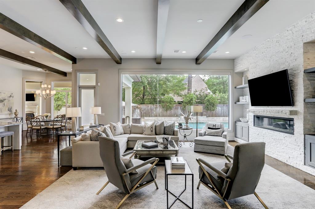 Family room with fireplace and views of the pool