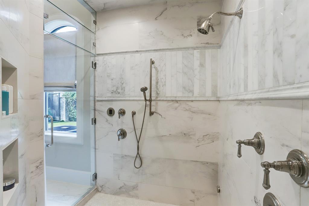 Primary shower with dual showers heads and a steam setting
