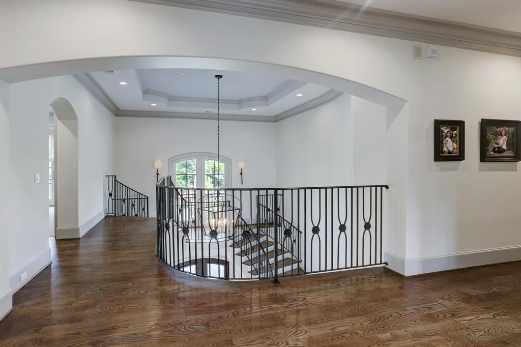 Second story view of sweeping staircase