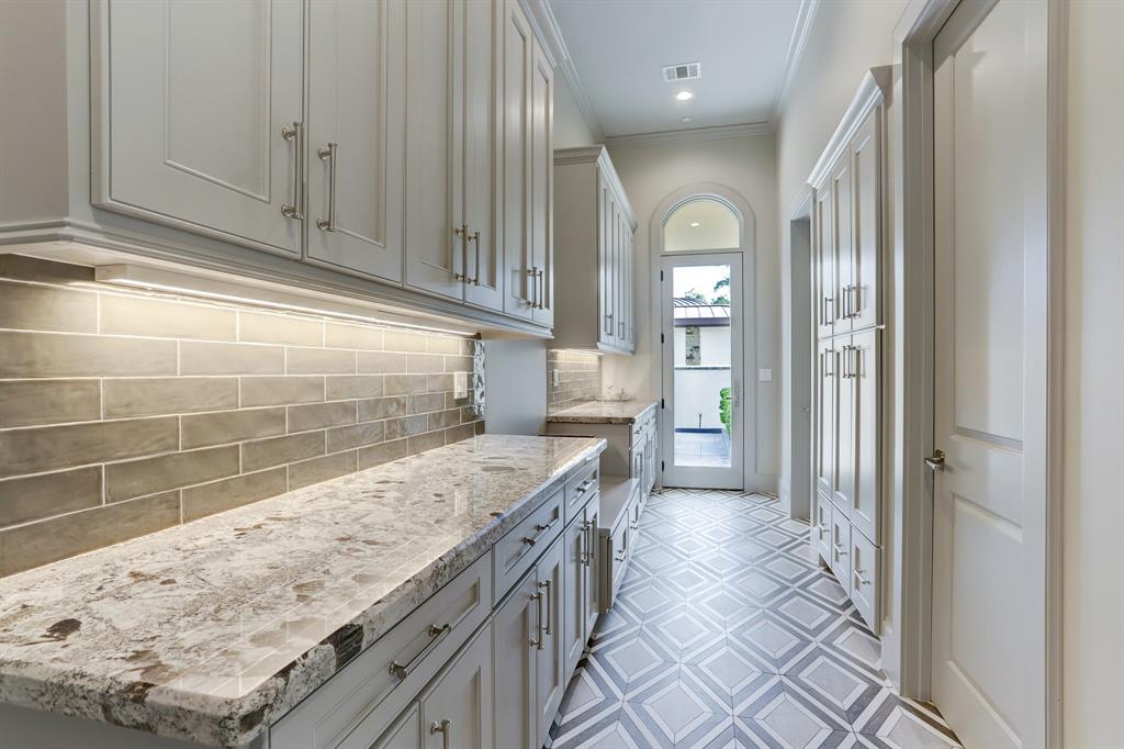 Spacious mud room located off kitchen