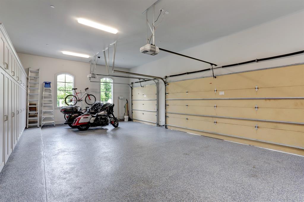 Three car garage with custom blue floor