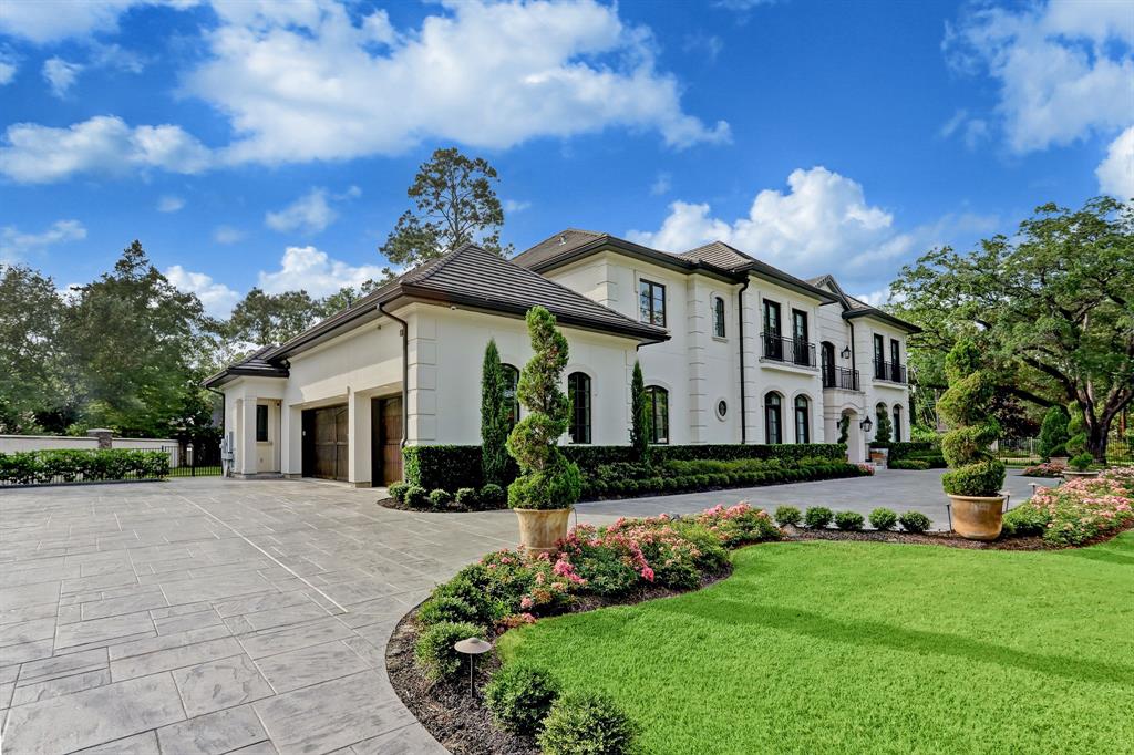 Large circle driveway with plush landscaping