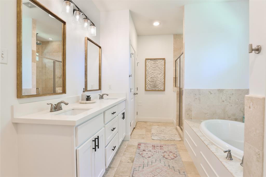 Primary bath includes double sinks.