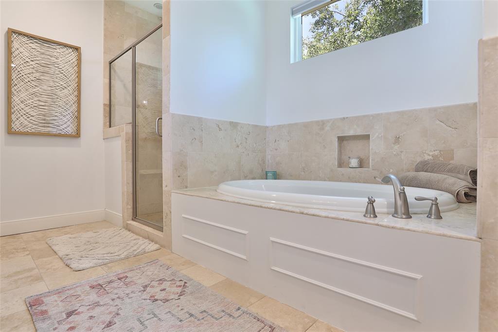 Primary bath with garden tub and separate shower.