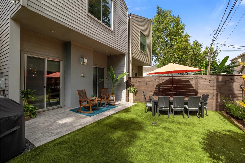 This home also offers a fully fenced backyard. The sellers have added low maintenance artificial turf. This backyard is a great area for the kids and dogs to play or to enjoy a relaxing afternoon on the covered and beautifully tiled patio.
