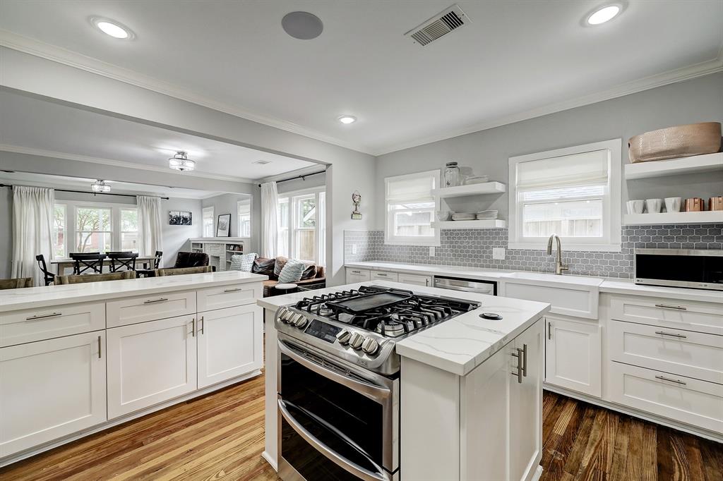 Note the gas range with double ovens, and window over the sink.  The design lines in this home are clean, classic and consistent throughout the property.