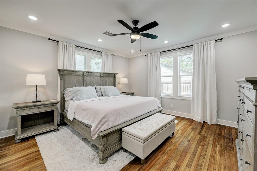 The primary suite at the back of the home is over sized, readily accommodating a king sized bed, wide night stands, storage bench AND a substantial dresser.  There is a also a walk-in closet and the drapes are 