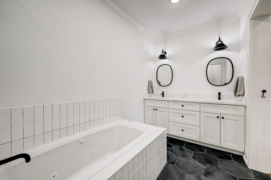 One last perspective of this luxurious bath with excellent cabinet, drawer and counter space.
