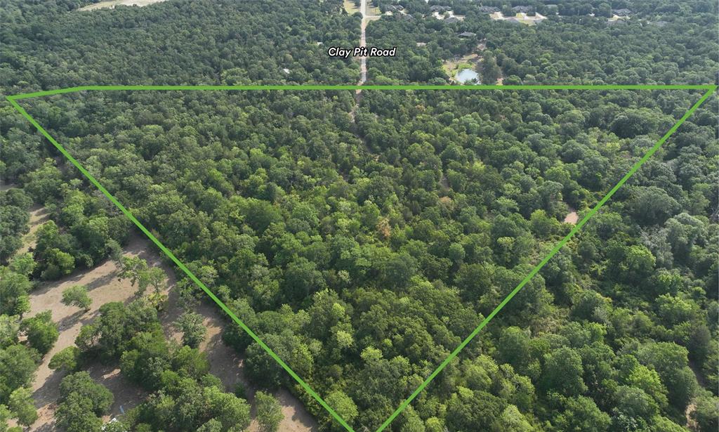 If you are looking for an amazing, unrestricted, and heavily wooded homesite in south College Station zoned to CSISD, this very secluded 29.50 acre tract located at the terminus of Clay Pit Road is ideal.  The tract is very heavily wooded and several trails have been cleared throughout the property.  A water meter from Wellborn SUD is on the property at Clay Pit Road and electricity is easily accessible currently 50 yards down Clay Pit Road from the property. The shape of the tract is triangular, with approximately 10% of the tract in the floodplain on the south side with 30 feet of frontage along Clay Pit Road.