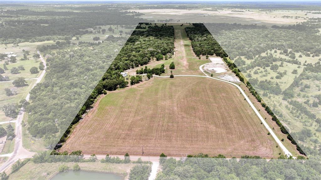 Welcome to Trinity Field in Midway, Tx. Once inhabited by a local Indian tribe, the property has several mounds that were used to raise their living structures above the surrounding elevation. This 69 acre property is a perfect location, just East of Interstate 45. 95 miles north of Houston and 150 miles South of Dallas. This unique property has a 2,500 ft long grass airstrip - TA82 - with runways 10/28. Perfect approaches both ways. A newly poured cement slab is ready for a 60 x 61 Hangar/Barn for Planes or Equipment. As you turn onto Bozeman Ferry Rd, you'll notice the pipe fence that fronts the property. Turn into the property a follow the treelined driveway to the house. The 2,276 Sq Ft 2 story home, completed in 2016, was constructed as a weekend getaway location . Enjoy your morning coffee on the front porch and watch the abundant wildlife start the day. In the winter, the woodstove adds charm and warmth to the entire home. Make your appointment today! #SearchTexasAirparks