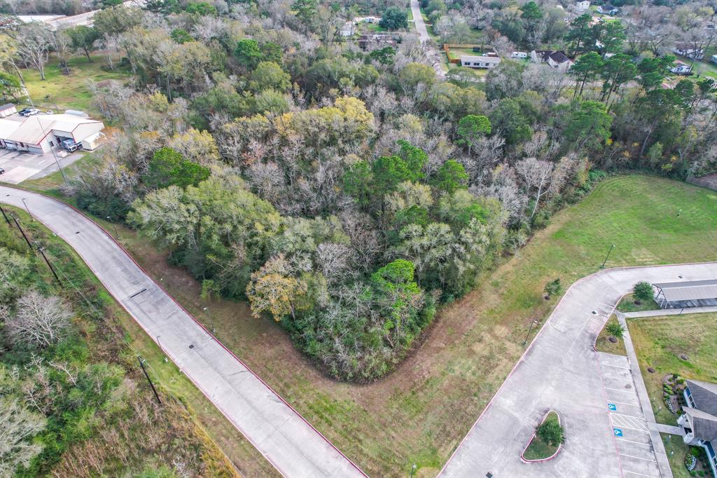 Great Property for Development! This 5.79 acres sits near FM2100 in Crosby. This lot is wooded and could potentially have access for water from nearby MUD. Property sits behind indoor gun range and apartment complex is on other side. Great potential for a storage business or warehouse, etc