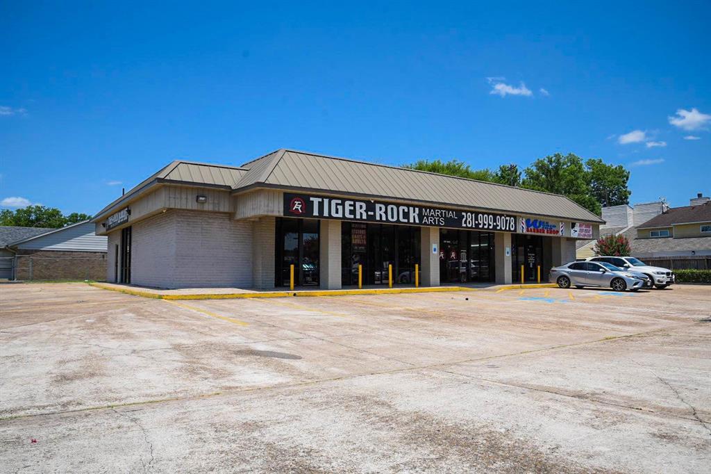 Lot is currently, being used as a shopping center with three tenants. Lot is unrestricted and can be used for any purpose. Call the agent for more information.
