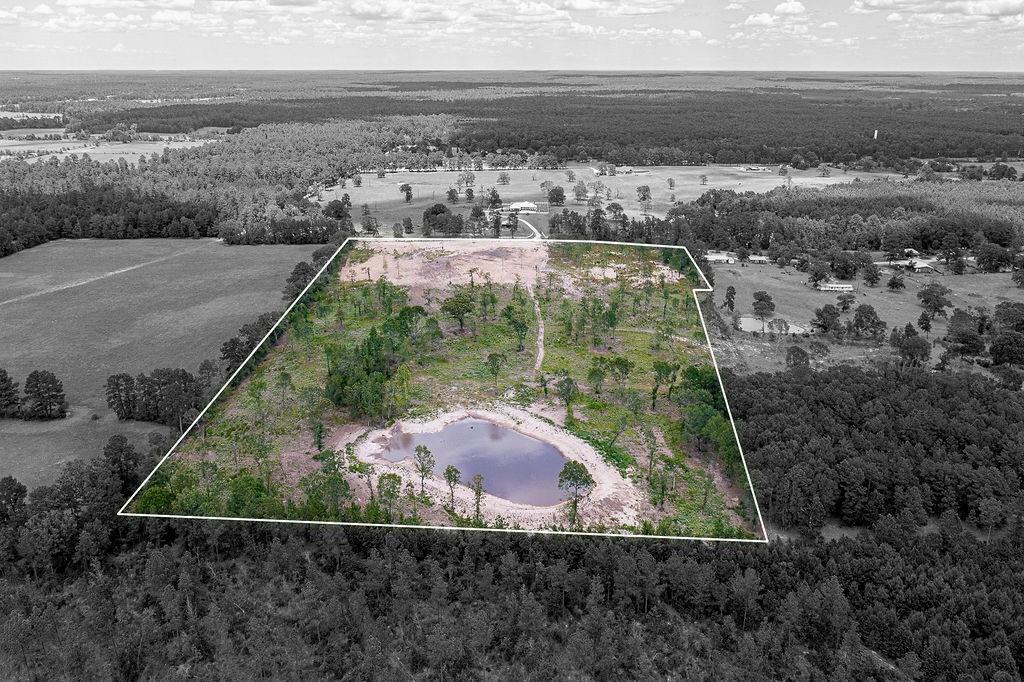 Check out this unrestricted 22.85 acre-tract located in the low-tax area of Trinity County! This partially cleared acreage has been fully mulched and features an abundance of wildlife such as deer, hogs, etc. + a large pond reaching up to 1.5 acres when it fills! Additionally, this property is fully fenced & is within 0.5 miles to the gravel road where utilities are available. This property is priced to sell and won't last long! Schedule a private tour today!