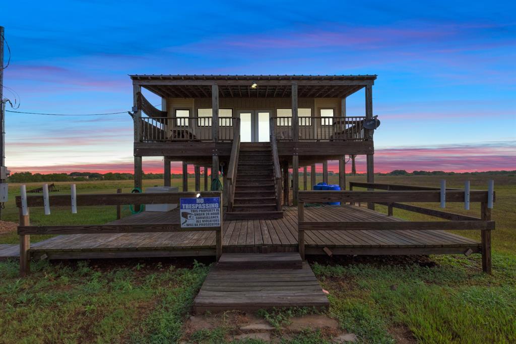 RARE OPPORTUNITY IN PORT LAVACA!!! - The 85 Acre fishing and hunting oasis that has been a duck hunting retreat and deer hunting retreat for 30 PLUS YEARS!!! The secluded property is equipped with an amazing view and FRONTING KELLERS BAY! The home has an updated roof in 2018 and it is located near protected wetlands and marsh. Enjoy duck hunting that is on the bay! You can enjoy a romantic sunset from the upper deck, build camp fires and ride horses or host fishing and duck hunting or gun dog training on your on ranch! Boats & Hovercraft as well as Fan boats are allowed to bring into the marsh and wetlands that back up the ranch! Schedule your showing today!