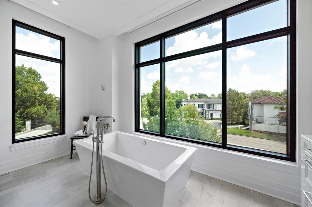 Gorgeous soaking tub acts as the centerpiece to the room.
