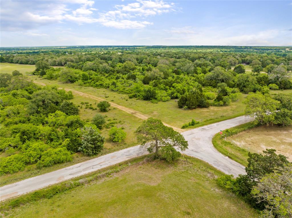 Unique opportunity located just outside of Austin, this beautiful +/-130 acre property offers impressive views, nearly a mile of paved road frontage, and great access to US-290 & Hwy-21. Situated in western Lee County, the Elm Creek Ranch sits 3 miles east of Paige between Bastrop & Giddings. In addition, the property is conveniently located just one mile from major highway(s) US-290 and Highway-21 which offers easy access & various travel routes into North Austin, South Austin and Downtown. With over +/-4,400 feet of paved road frontage and water lines along the roads, The Elm Creek Ranch would make for a perfect multi-use property. There is power on-site and along the county road. The land offers rolling topography with over 60 ft. of elevation change and has two nice sized stock tanks. The tract consists of a combination of densely wooded areas, scattered trees and plush pastures. The property is Ag Exempt and is currently being used for grazing.