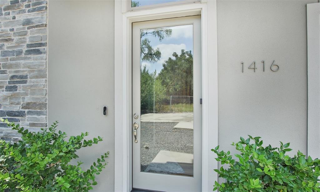 Beautiful glass entry door on this stone & stucco masterpiece