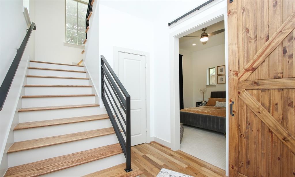 Luxurious appointments include hardwood floors & stairs combined with clean wrought iron railings