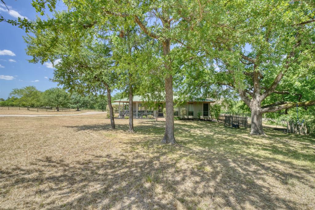 Located just 5 miles west of Texas A&M University you will find this 3 bed 2 bath home with apx. 4 acres tucked away at the end of Kemp Rd (paved). Property was utilized as a horse facility for many years, equipped with a horse barn, stalls and a tack room. There are multiple turn out traps that have not been used in quite a while and will take a little work to bring back to its original design. The house has an open concept living area with a spacious kitchen and screened in back porch. There is a 2 car detached carport with a walk way to the house as well. Schedule your showing to come view this awesome property.