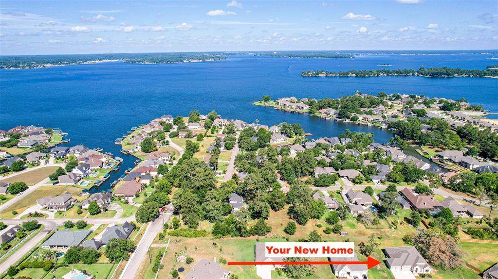 RARE opportunity to own a new ONE STORY HOME with LAKE ACCESS to LAKE CONROE on about HALF AN ACRE of land! This is such a rare and sought after combination! The community of Water Crest is beautiful and has a gated private boat ramp for residents. There are also parks, trails, and ponds to enjoy or go fishing out of. The community pool sits up on a peak overlooking Lake Conroe for majestic views. You are close to I-45 for quick access to Conroe, The Woodlands, IAH, Houston, and hospitals and services we use every day, but it's also set back far enough away that there is PEACE AND QUIET in this gated section. You'll love the location and convenience this home offers. The home itself is better than new as the current owners have made it better through landscaping improvements, water filtration and maintained it in meticulous fashion! You'll love the open floor plan that is great for entertaining with latest design features. WIDE OPEN spaces in this home, and FOUR CAR GARAGE!!! WOW!