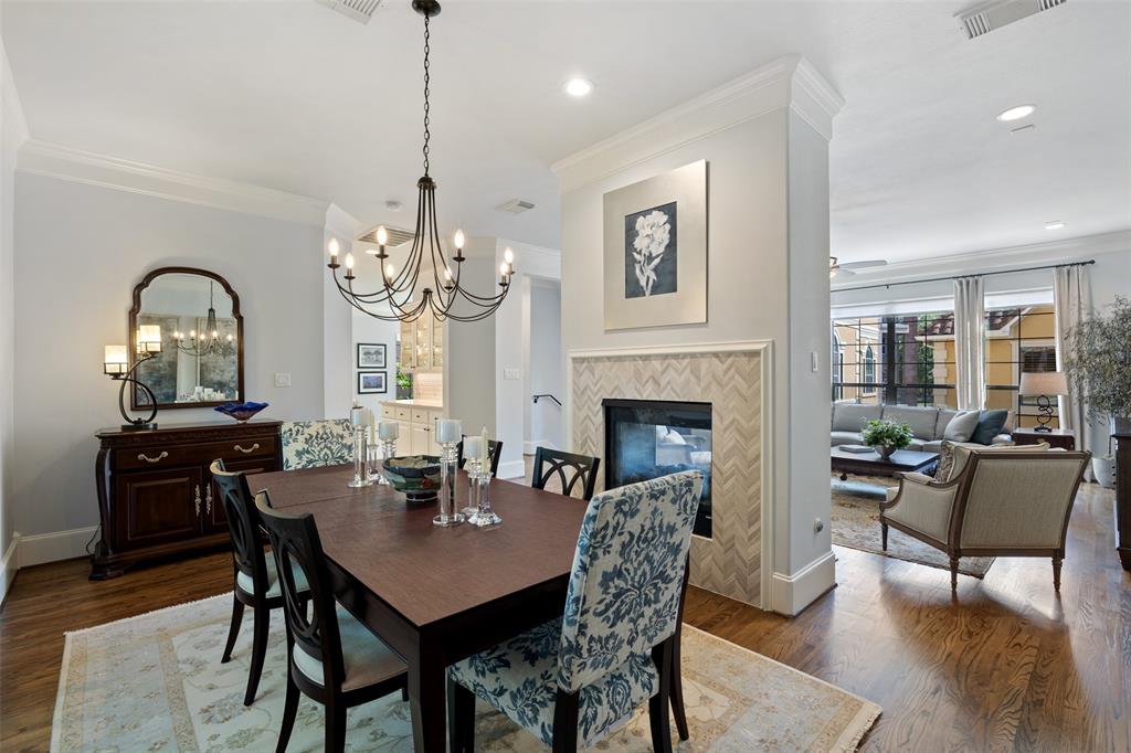 Formal dining room enjoys the double sided fireplace