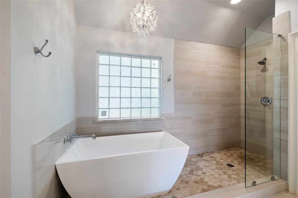Walk-in shower and soaking tub in the primary bathroom