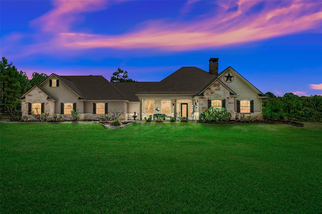 Good bye City life. Claim this Austin stone Hill Country ranch on 4 Acres, lined by majestic grand trees, overlooking a Texas sized tranquil pond. Views are fully acclimated to take in the pastoral scenes of water & verdant green space from tall windows & 82 ft of covered patios. BYO fishing pole & horse. Barn, pasture & 9ft deep diving lagoon pool complete this rustic retreat. It's a sprawling forever plan, with large light filled gathering spaces plus giant Gameroom up. Spacious, open living with 4 large Bedrooms down plus a home office/homework station. Upscale finishes & recent carpet make it ready to move in. Acclaimed MISD! Larger NBHD lake too. Quiet leisure awaits. Upscale enclave of acreage estates gives you an "away from it all" feel while still being conveniently located. All within 2 miles of Old Downtown Montgomery with shops, eateries, small town festivals, flagship grocery; 5 miles to Margaritaville & Lake Conroe; 25 minutes to The Woodlands; 40 minutes to IAH Airport.