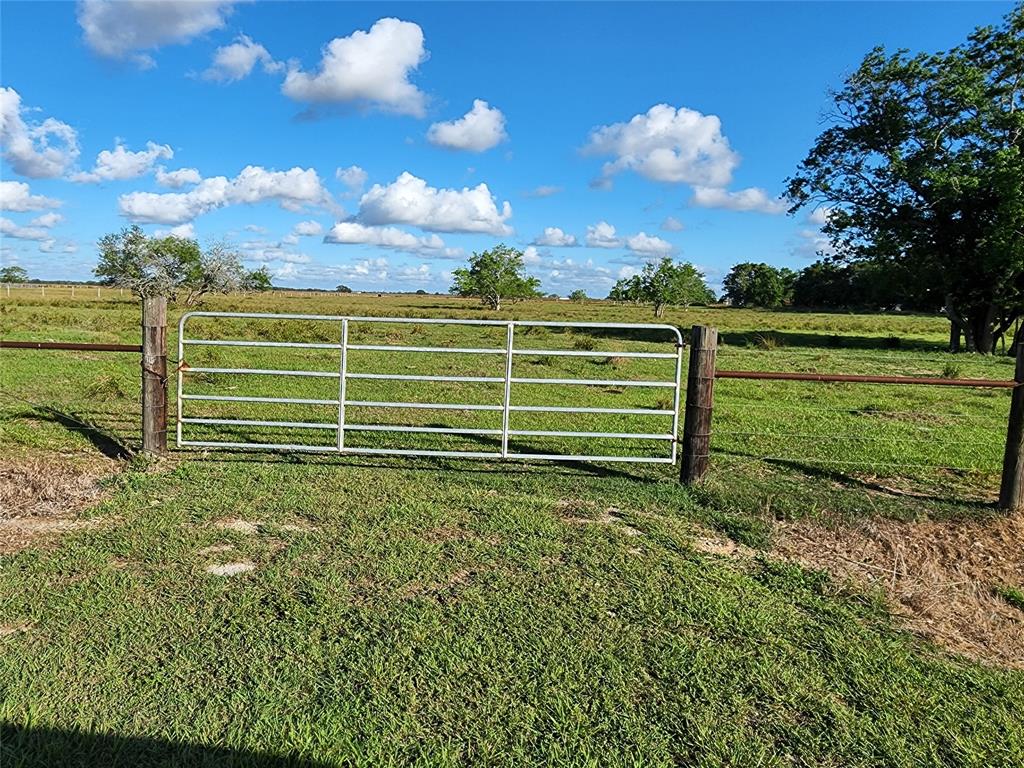10 Acres nestled on a quiet street in the small town of Markham, TX.  Good road frontage, fully fenced, raised driveway over a culvert leads to the front gate.  Scattered trees on the land and full line of trees on the West fence-line create a shady refuge for livestock on the warmer Summer afternoons.  Currently Ag Exempt.