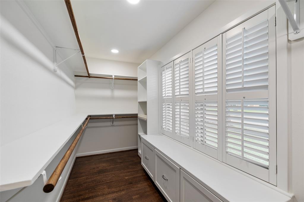 The primary suite features a large walk-in closet with built-in storage.