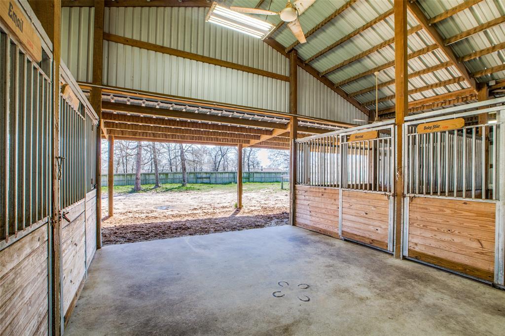 4 horse center aisle stalls with fans, water, & electricity
