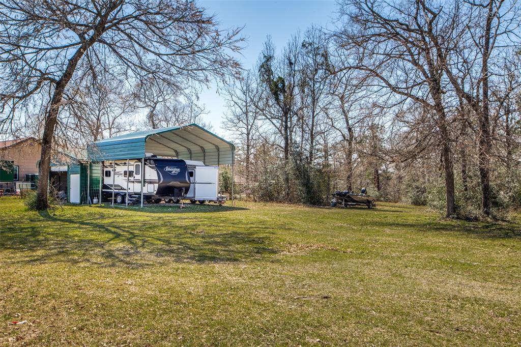 Property has RV Canopy with steel storage building
