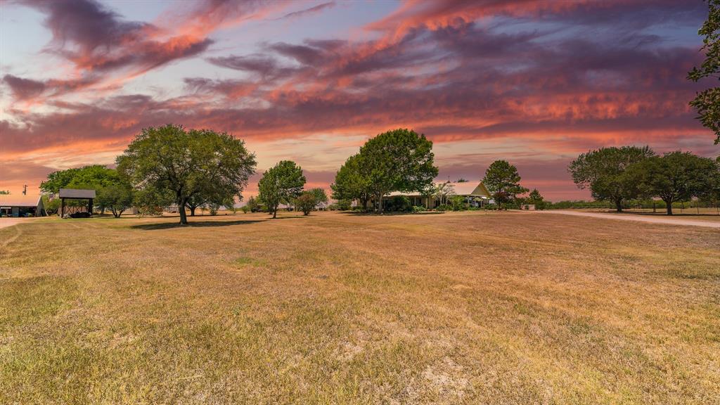 Rural Living at its finest! This magnificent 119 +/- acre ranch encompasses a 3/2 main home w/3 car carport, high ceilings throughout, open floor plan & built-ins. 1250 SqFt income producing guest home/B&B w/1 bedroom, full kitchen, patio & small shop. 1600 SqFt manufactured home w/soaking tub, walk-in shower, vinyl flooring & walk-in closets . 3 water softeners, 2 Water wells & 3 septics. Horse barn w/3 stalls, water/electric, sand bottom runs, tack/gym room, covered patio area, riding arena w/lights, water & electric. The 3000 SqFt square bale hay shed offers 1 concrete bay & 2 gravel bays, 5000 SqFt hoop house for round bales, working cattle pens w squeeze chute & RV hook ups at equipment shed. 2 stock ponds, a private fishing pier, 2 improved grass pastures, fenced, cross-fenced, much w/net wire & pipe. Garden shed, several storage buildings, multiple electrical meters & water to all pastures. 4 poultry income producing chicken houses, each 530'x42'. Endless potential, must see!