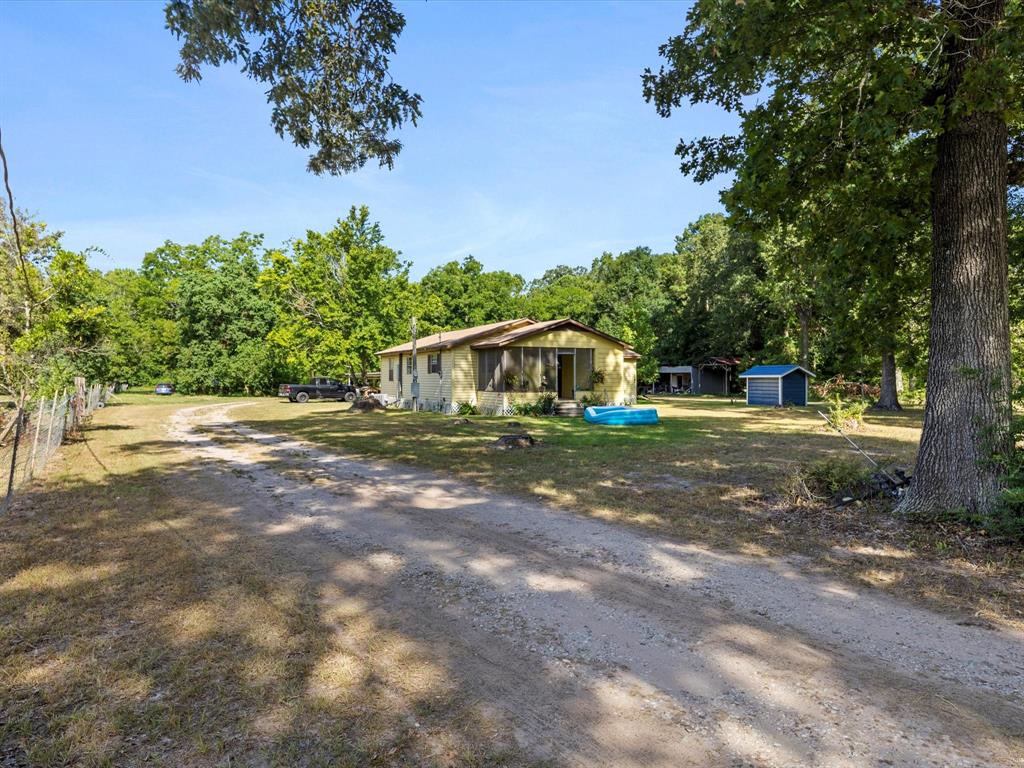 Three bedroom, one bath house sitting on 6.22 acres in Cleveland, Tx. Property is fenced and cross fenced, ready for livestock. No restrictions, No HOA, no neighbors!