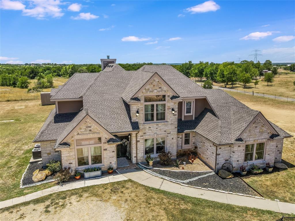 This picturesque 14-acre ranch is a retreat from city life yet situated only 7 minutes south of Hwy 290 in Elgin.  The move-in ready executive home is a comfortable 3,840 sq. ft. including 4 beds; 4.5 baths; office, 3 living areas/game rooms. Outside is a 2-car, detached garage. The nearby 525 sq. ft. guest house can serve as the ranch caretakers apartment, short-term B&B rental, or multi-gen living. With 1-bedroom, 1-bath, kitchen, and eat-in dining, long-term rental potential is estimated at $1,100 per month. The stock pond -- flanked by generous, mature trees has served not only as a watering hole for livestock but as a favored fishing spot. Indeed, the ranch's list of highlights is too numerous to list here. Of important note are the gas stove and fireplace; covered RV space; remodeled, primary bath; and new roof
as of spring 2022. Tax rate is a low 2.15% Square footage per appraisal. Easy to show. Call your agent to schedule a
tour today