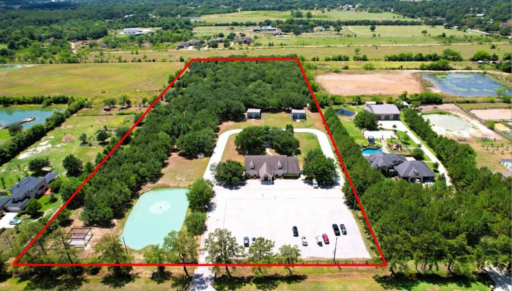 11 Acres of unrestricted land on a Semi-Wooded Property in Cypress available for purchase. Currently being used as a Wedding Hall & Events Center.  Main Hall is 4,716 sq. ft. (primarily open space) with two additional dwellings around 1,100 sq. ft. each, a pond, a flower garden, 2 Gazebo's and a built-out storage building.   The two homes on the property were built for bridal party suites.  All light fixtures, equipment and furniture currently being utilized to run this business will be conveyed w the sale.  The possibilities are endless to this property--nestled in a community surrounded by million-plus dollar homes: subdivide and build several homes, great for nursing home facility or  keep as an event center!  Check out the 3D virtural tour and Call for information and to schedule a viewing.