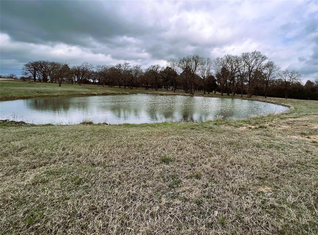 10 acres of prime, beautiful land with a pond, trees, and pastures. Quiet and serene for the perfect getaway in this beautiful Texas country, waiting to be modeled by your vision of the perfect home. This growing area has so much to offer, featuring a mixture of hardwood trees and gently rolling pastures. Utilities are expected to be put in by the end of the year. Live the country life or hold on to it until you retire or decide to capitalize on this great investment. This subdivision is 30 minutes or 25 miles east of the Taylor Samsung Mega site, and 50 minutes or 46 miles northeast of the Tesla Giga site in Austin TX. Build now and live the country life or hold on to it until you retire or decide to capitalize on this great investment